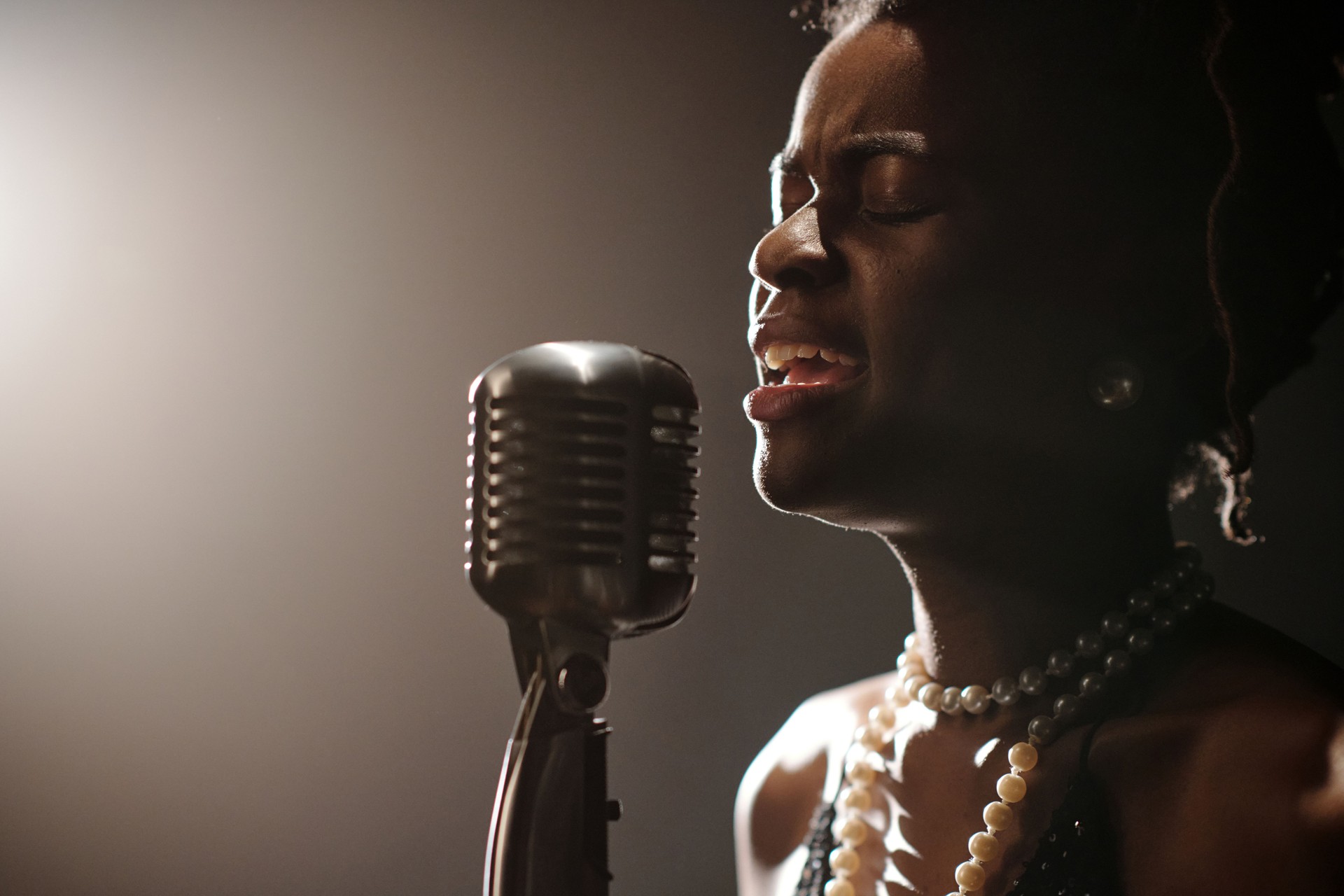 Young Vocalist Immersing Herself in Soulful Jazz Singing Performance